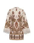 A cream-colored embroidered tunic jacket with intricate brown, gold, and red paisley patterns, featuring white feather trim at the flared cuffs and hem, shown from the back on a white background.