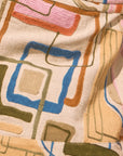 Close-up of a textured fabric with geometric pattern in earthy tones