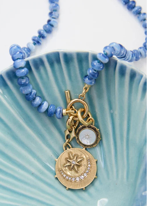 Viva Sol Necklace close up on blue tray
