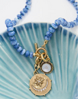 Viva Sol Necklace close up on blue tray