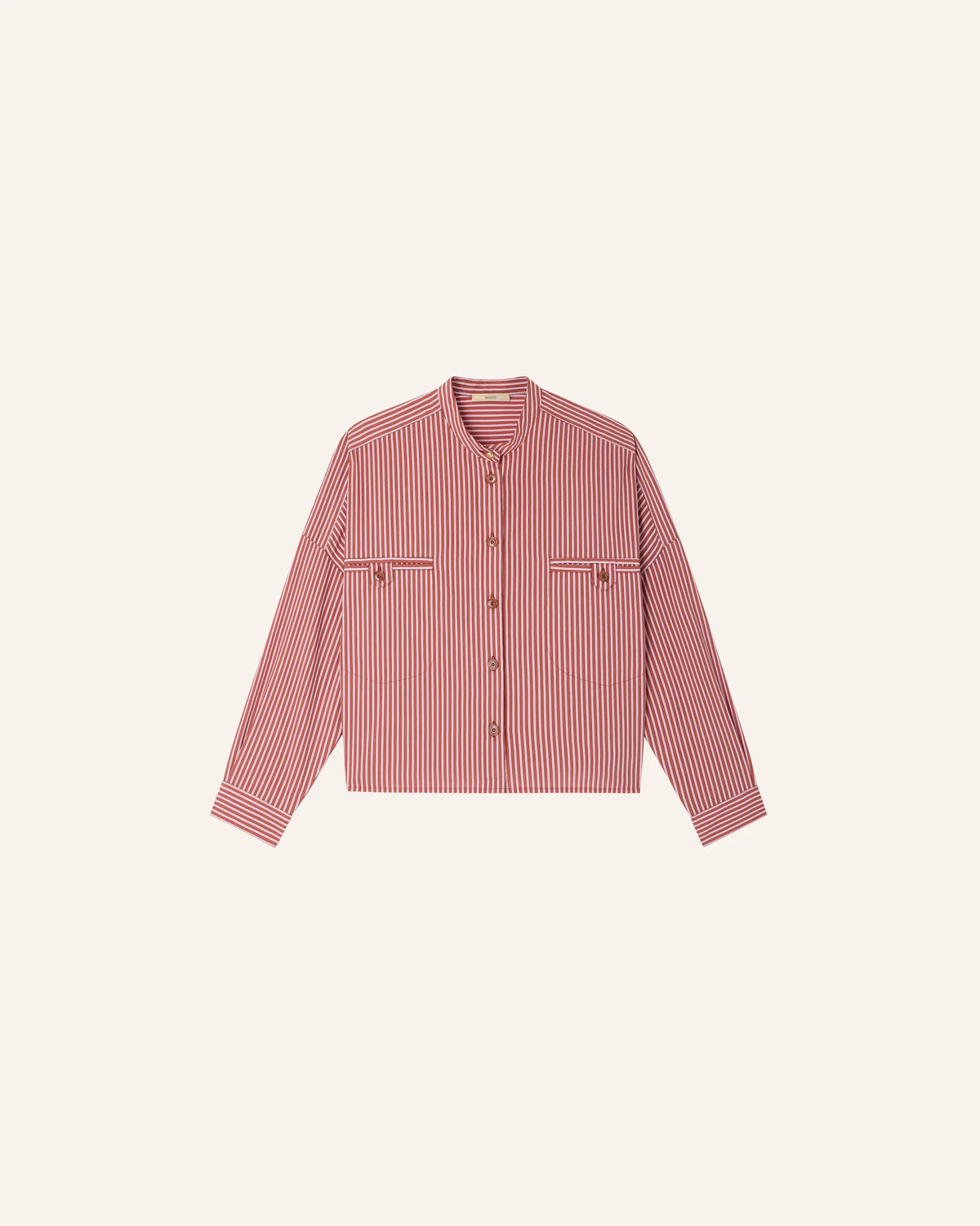 Pink striped shirt on a light beige background