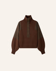 A brown knit sweater with contrasting olive green shoulder panels and a high mock neck, featuring a buttoned placket with gold-tone buttons, shown against a solid off-white background.