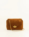 A brown suede shoulder bag with a gold-tone metal clasp and a gold chain strap, photographed against a plain white background.