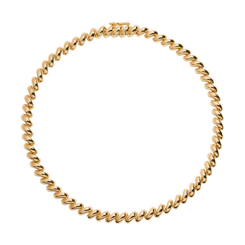 Gold chain necklace on a white background