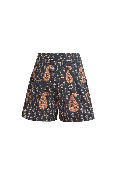 A pair of high-waisted shorts featuring a black base with a detailed paisley pattern in rust orange and small white floral motifs, shown against a plain white background.