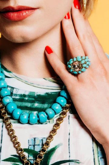 Elliot Ring in Turquoise on model paired with matching necklaces