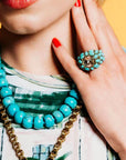 Elliot Ring in Turquoise on model paired with matching necklaces