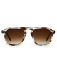 Sunglasses with tortoiseshell frame and gradient brown lenses on a white background