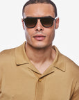 Zander Black + Black Tea Sunglasses on male model with wide square face shape