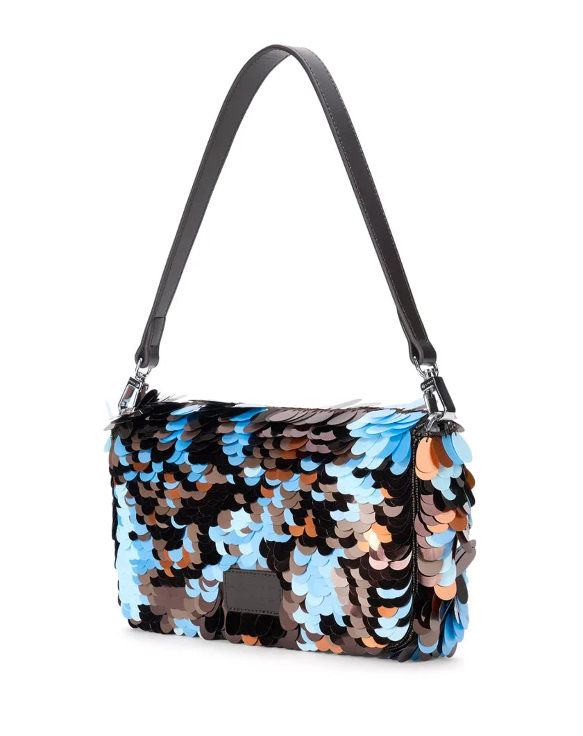 A rectangular shoulder bag covered in large, reversible sequins in shades of blue, brown, black, and beige, featuring a black leather shoulder strap and silver-tone hardware, back