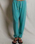 Johnny Sweatpant in Teal Blue close up front view on model