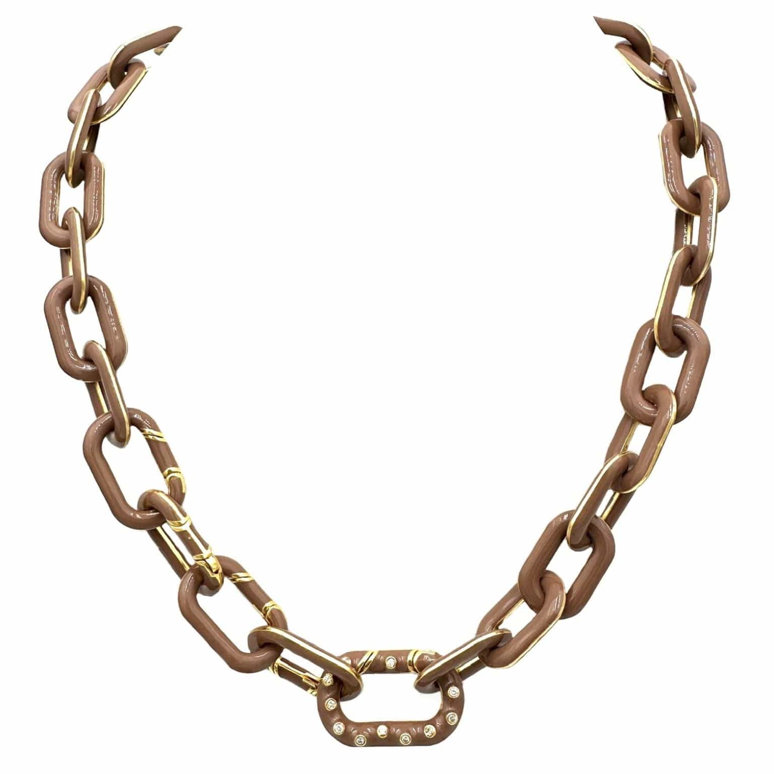 A chunky chain-link necklace with alternating matte brown and polished gold links, featuring a decorative gold clasp adorned with small clear rhinestones, shown against a plain white background.