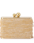 A rectangular woven clutch bag in a textured gold and beige pattern, featuring a gold metal frame, two gold spherical clasp knobs, and delicate fringe details along the sides, set against a plain white background.