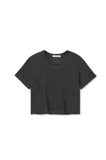 cher short sleeve vintage black tee with jeans on a white background