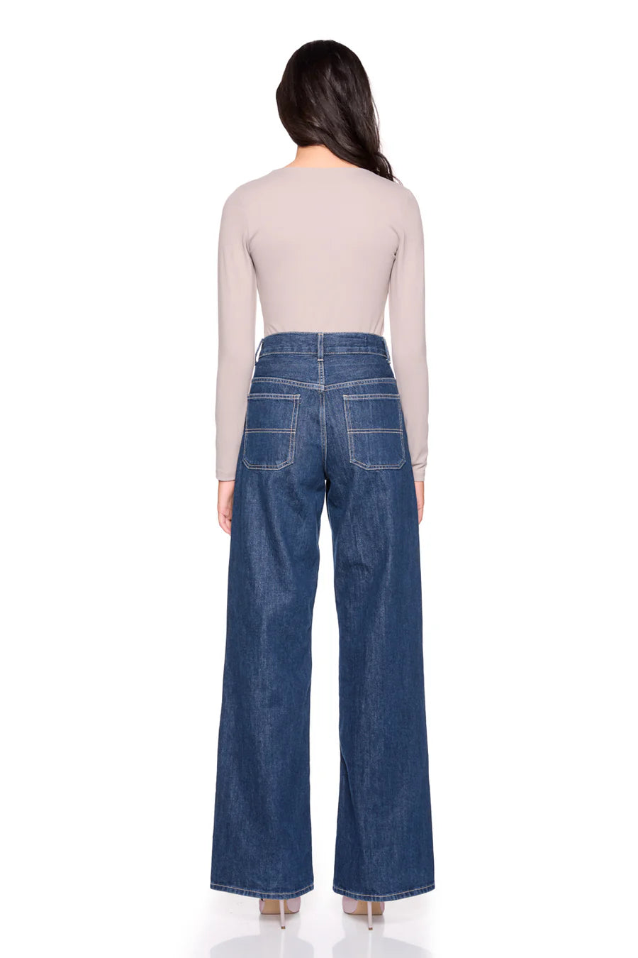 vneck long sleeve top in sandstone on a model wearing jeans with a white background back view