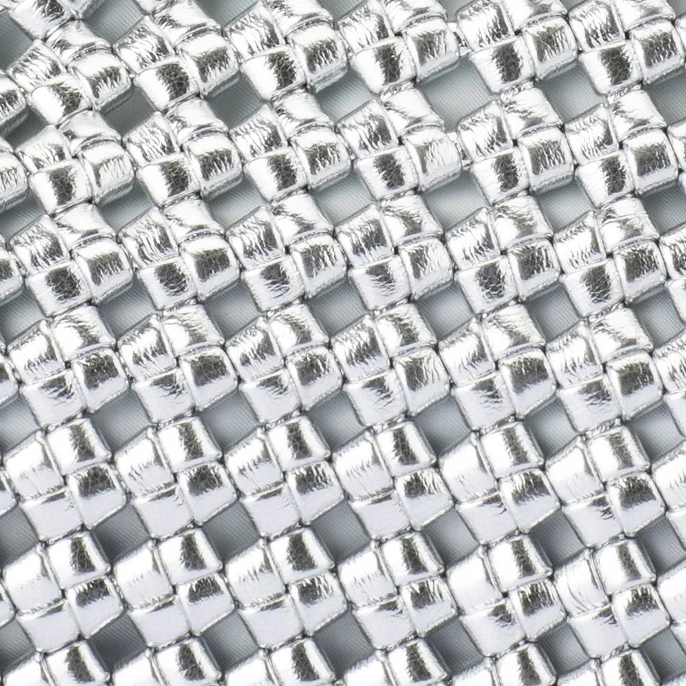 Close-up of a metallic woven pattern