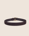 brown belt with a gold buckle on a cream background