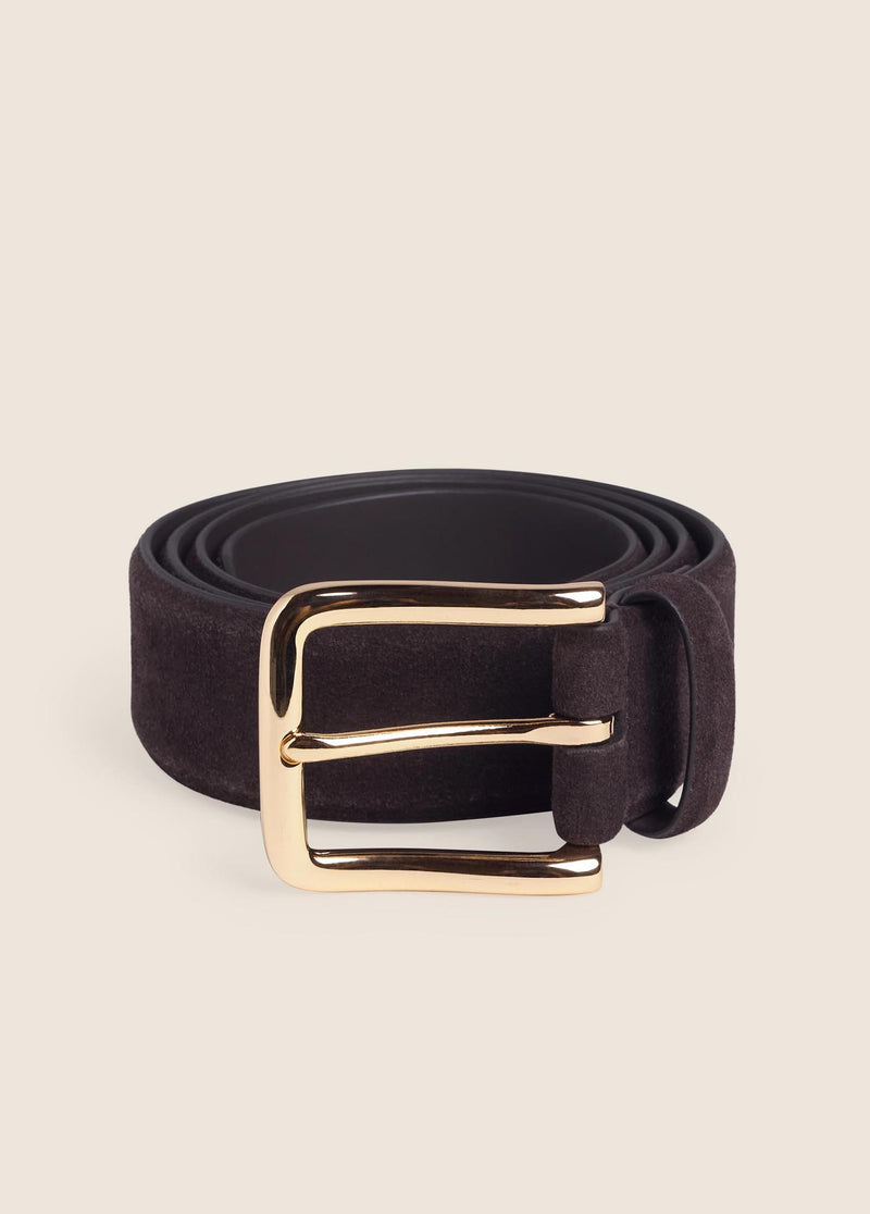 brown belt with a gold buckle on a cream background