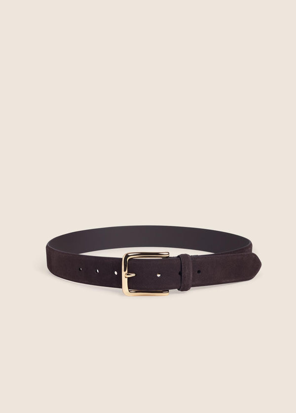 brown belt with a gold buckle on a cream background