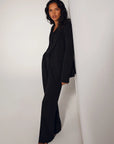 The Favorite Pant in Black side view, with vest and blazer