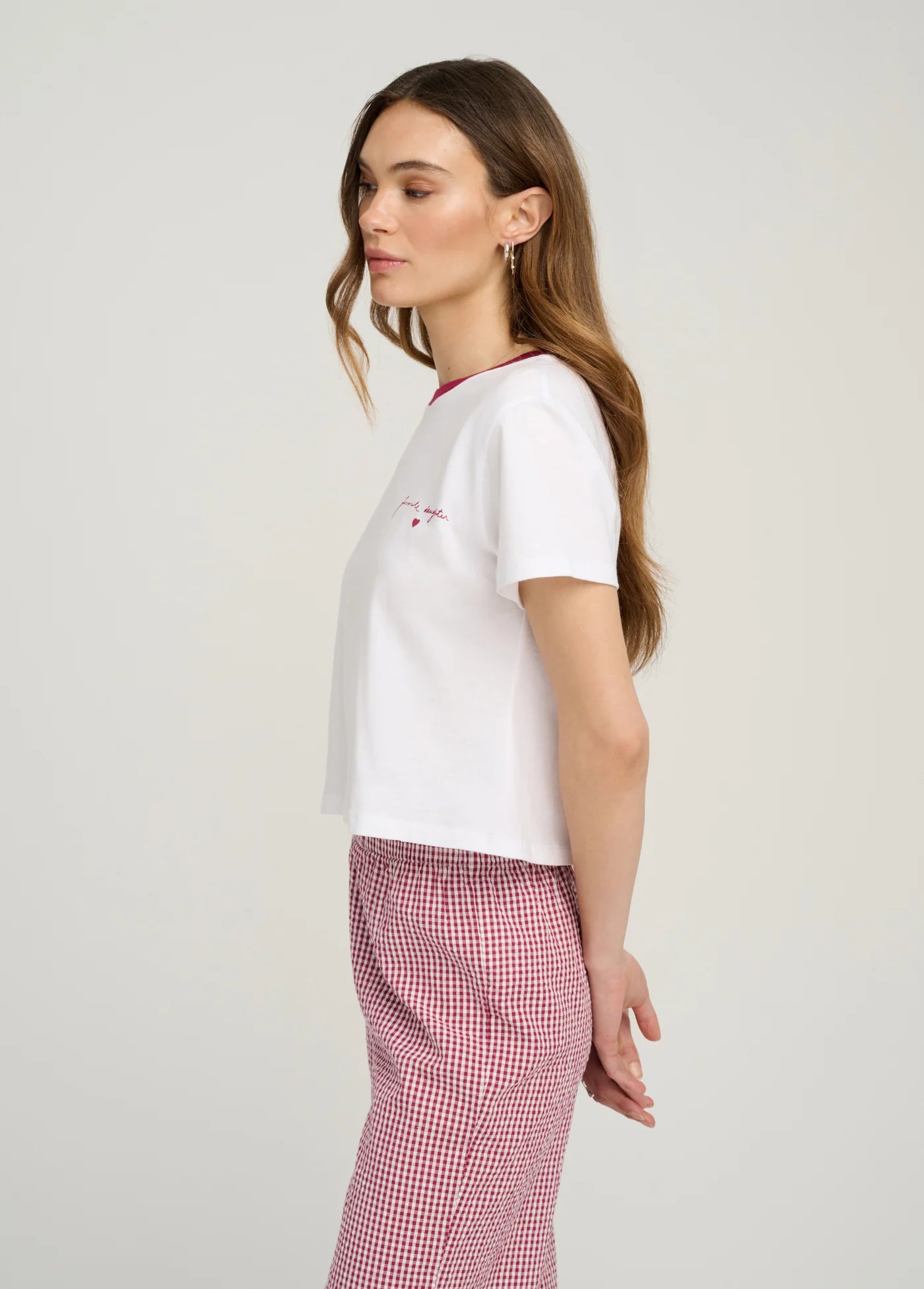 The Signature Chest Logo Ringer Top close up side view on model