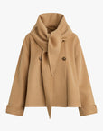 Tan coat with a scarf on a white background