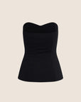 A black strapless corset-style top with a sweetheart neckline, photographed against a solid light beige background.