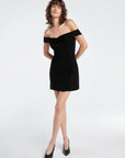 The Payback Dress front view, hands behind back
