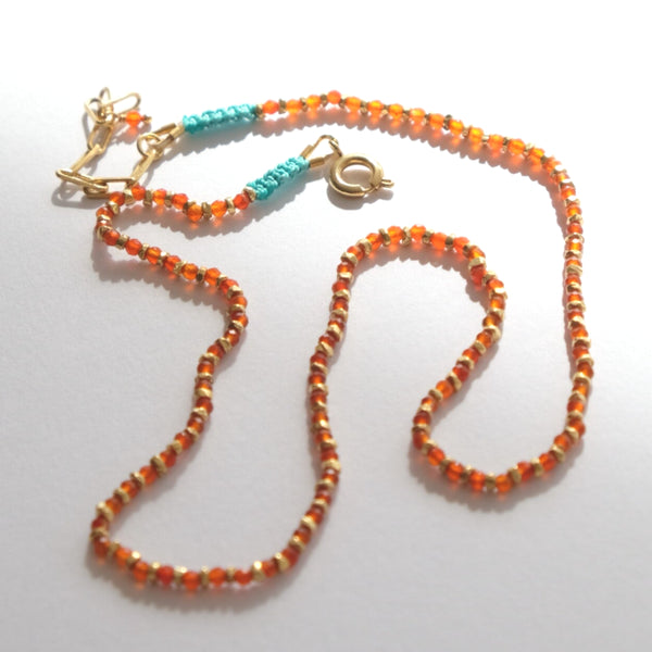 Mini Cerezo Necklace Red Onix laid flat