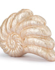 Decorative shell clutch with a wavy pattern on a white background
