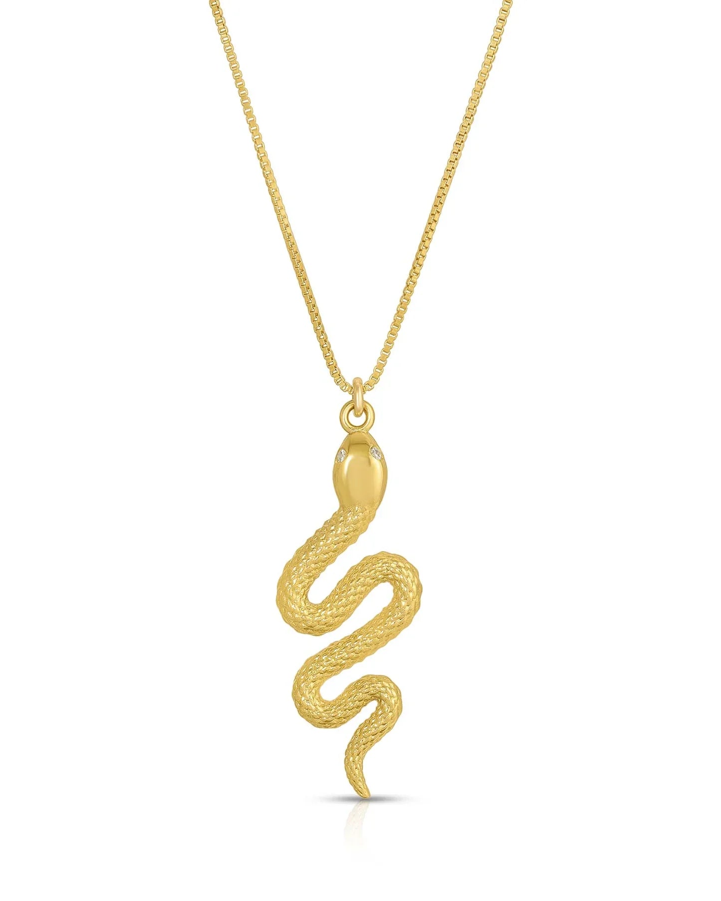 gold snake charm on a gold necklace chain 