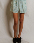 julie stripe short on a model with a cream background