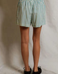 julie stripe short on a model with a cream background, back
