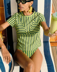 Kini Striped Tee on model sitting in beach chair