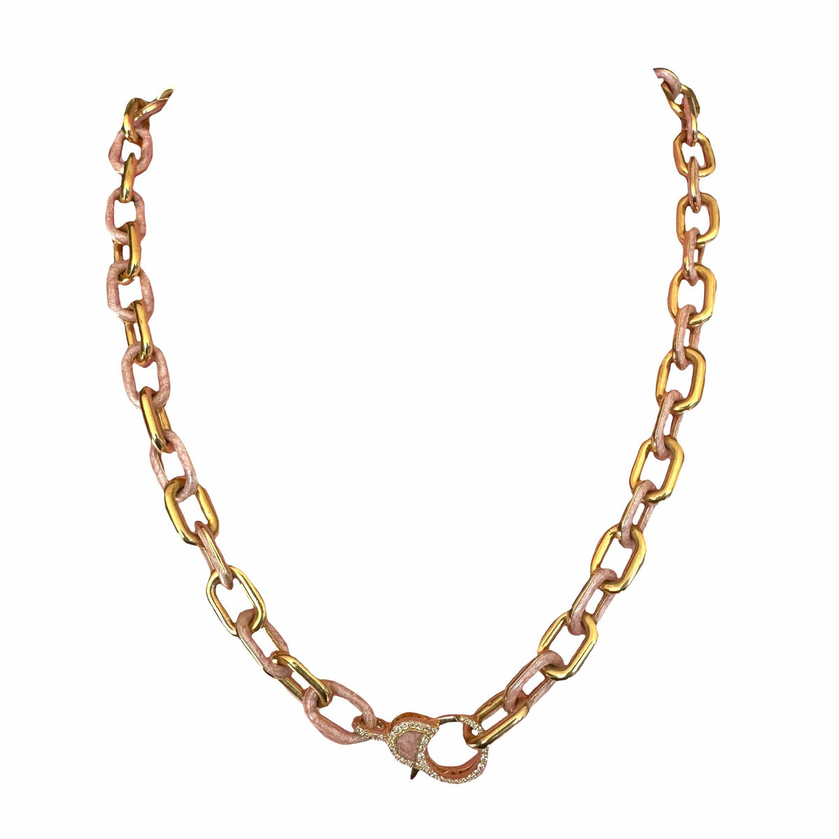 A two-tone chain necklace featuring alternating gold and rose gold oval links, with a small gold heart-shaped charm on a white background.