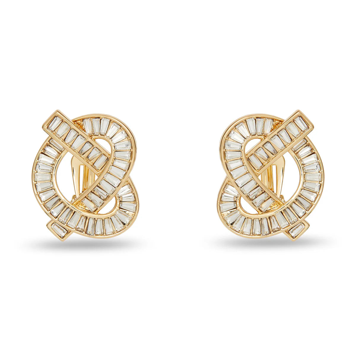 Gold and crystal earrings on a white background