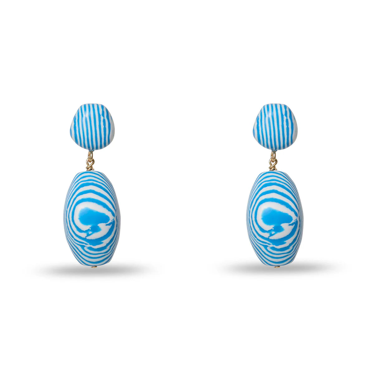 blue and white earrings on white background 