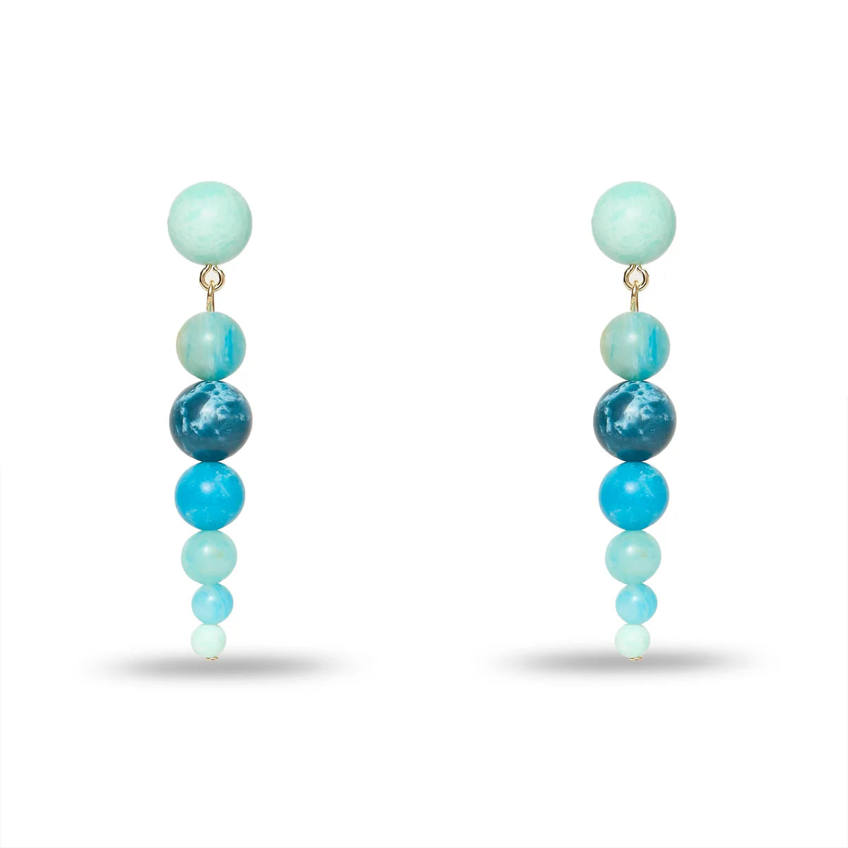 Pair of earrings with blue and green beads on a white background