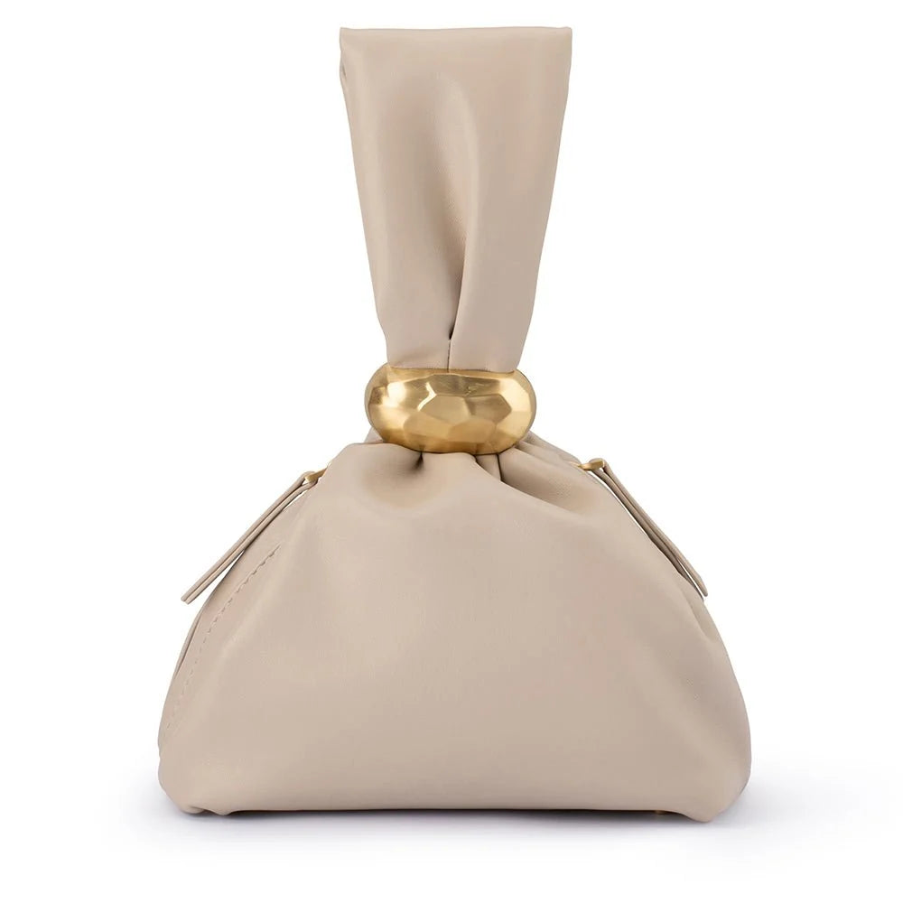 Beige fabric with a gold ring on a white background