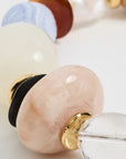 Close-up of a glass bead necklace on light background