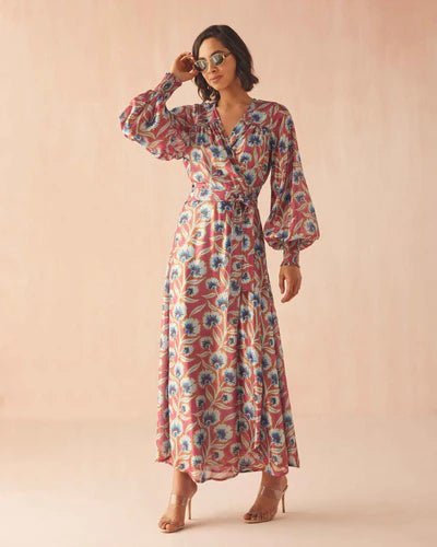 Woman wearing a floral dress on a beige background