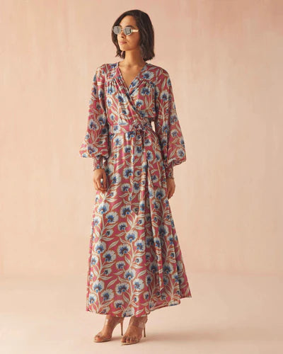 Woman wearing a floral dress against a beige background