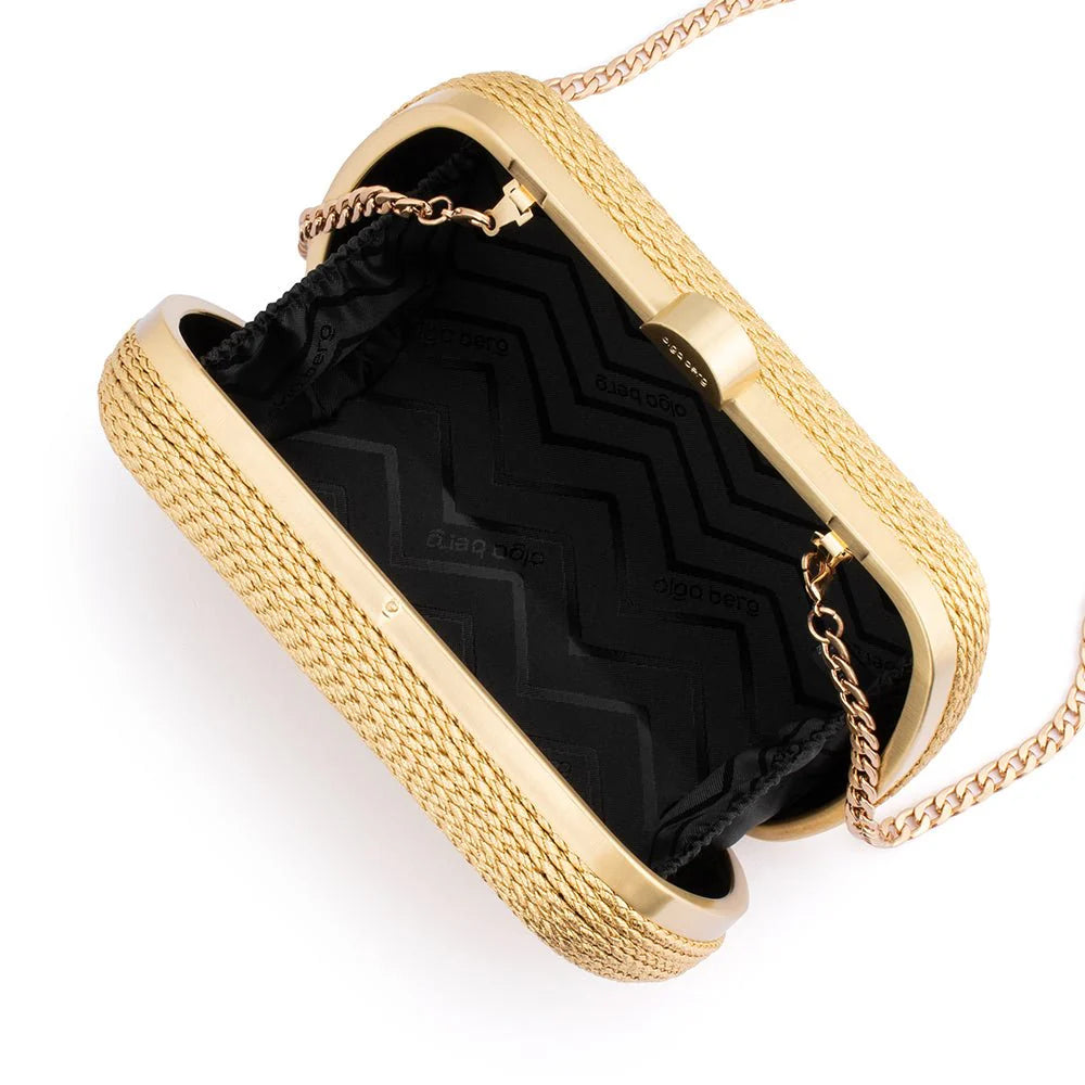Gold clutch with black interior on a white background