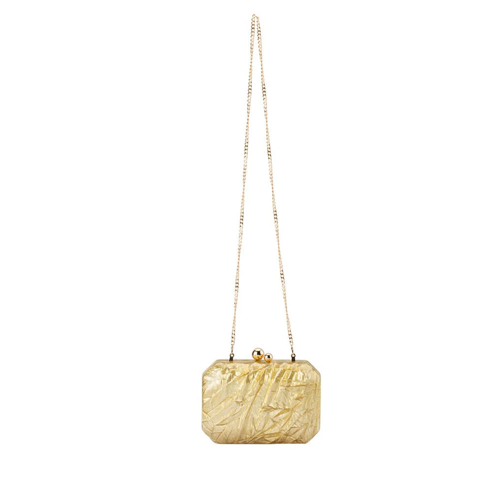 Gold clutch bag with chain strap on a white background