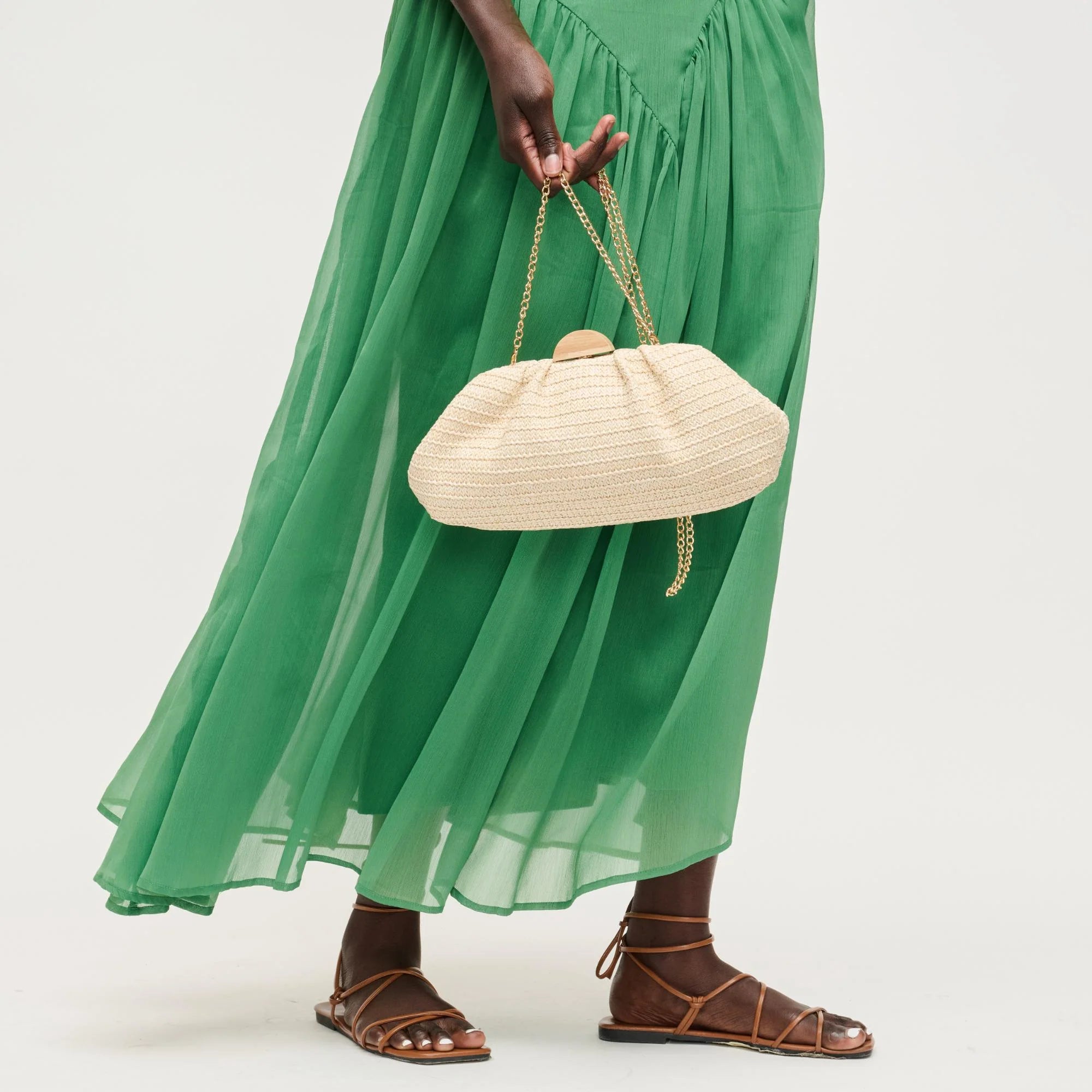 Dorothea Clutch held at model's side