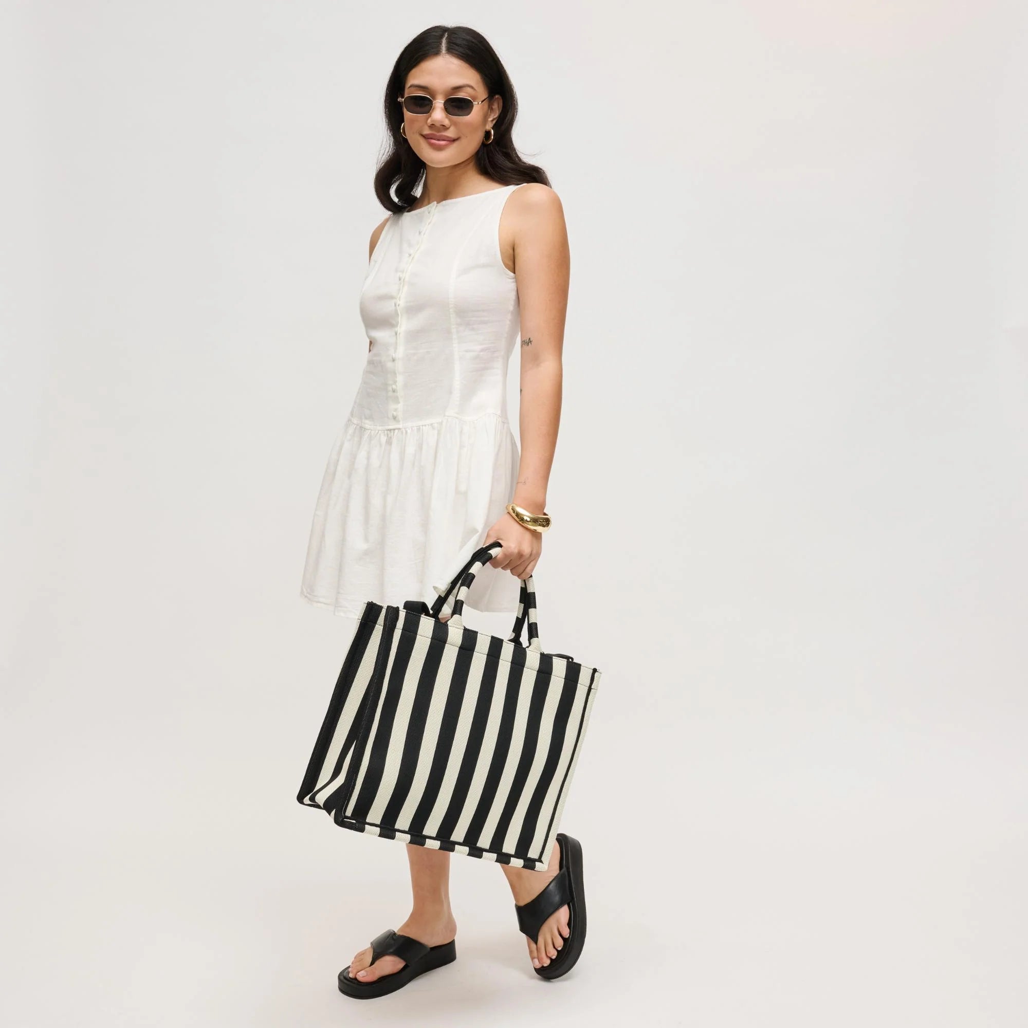 Iona Tote Bag held at model's side