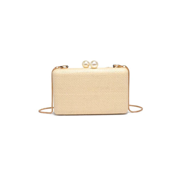 Beige clutch bag with pearl embellishments on a white background