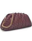 burgundy clutch with gold chain strap on white background