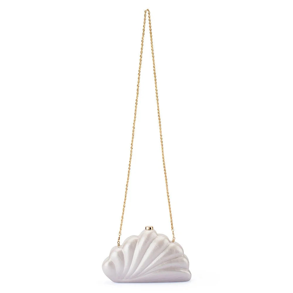 A white shell-shaped evening clutch bag with a gold-tone chain strap and clasp, shown against a plain white background.