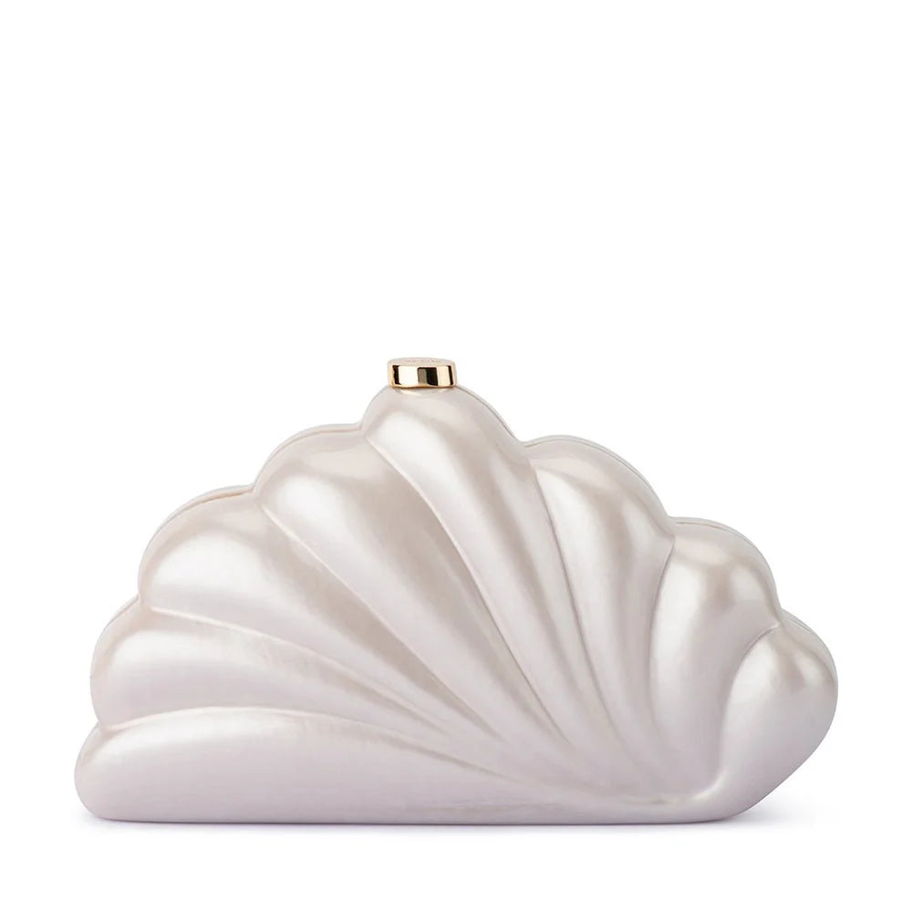 A shell-shaped evening clutch bag with a pearlescent white finish and a small gold clasp at the top, shown on a plain white background.